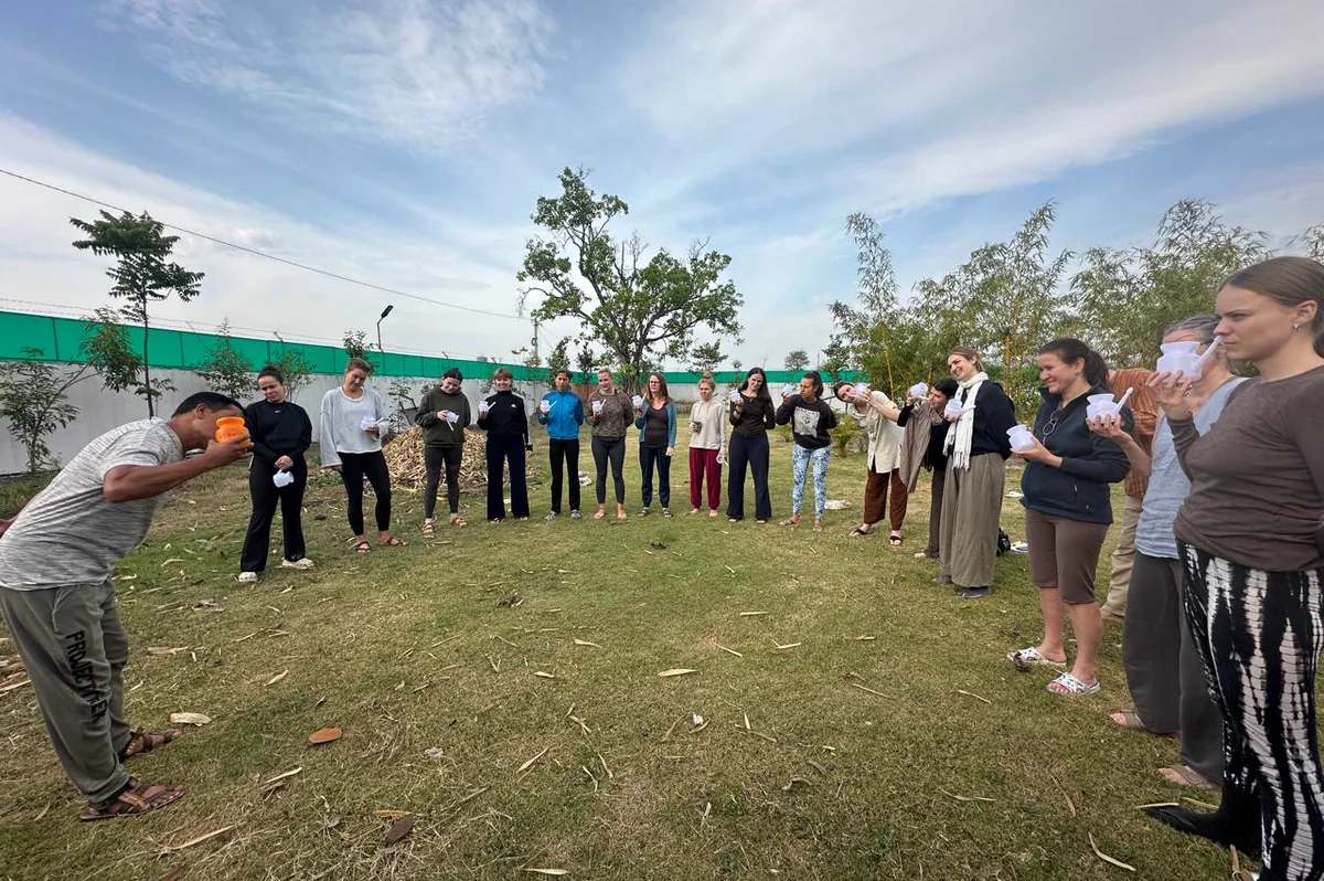 Students practising Jala Neti outdoors